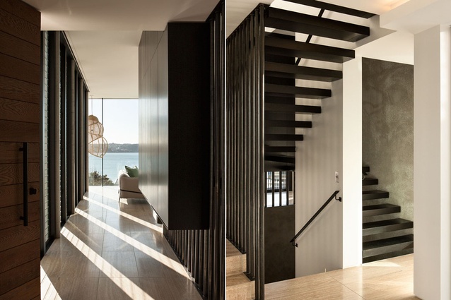 A short corridor space accesses the living area, creating a vignette of the view beyond. To the right is the central staircase, which leads from the lower level.  