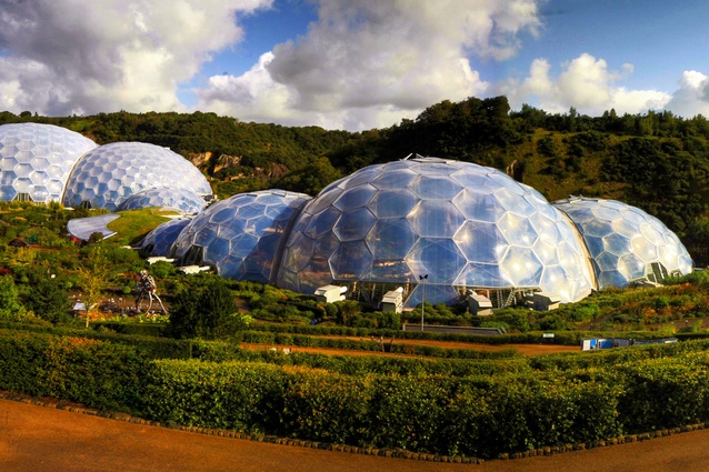 Eden Project, Cornwall, UK by Grimshaw Architects. The biomes' cladding is made of triple-layered pillows of ETFE foil. Structurally, each dome is a hex-tri-hex space frame reliant on two layers.