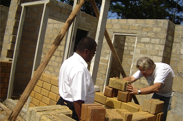 Gerald Melling laying bricks at Kalutara Resettlement Village, Sri Lanka.