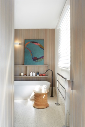 Soft hues and textures are used in the main ensuite. Artwork: Belem Lett.