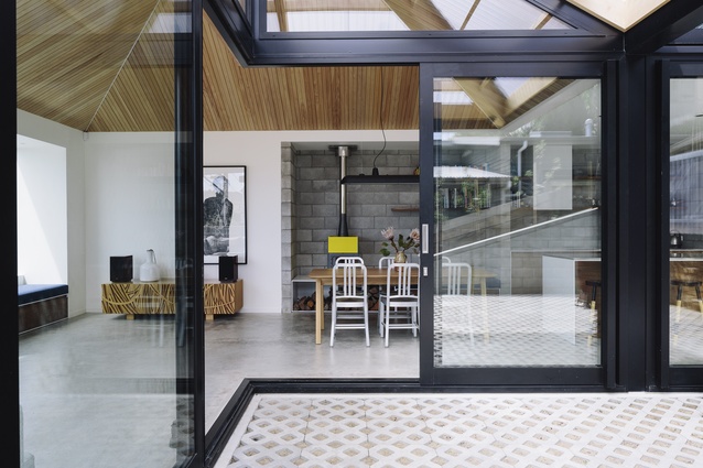 Interior of Pyramid Scheme, Wellington. The light-filled home features black colour steel and macrocarpa bay windows.