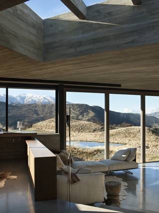 Underfoot, polished concrete floors echo the reflective water feature outside, and the Lake Wakatipu in the distance. 