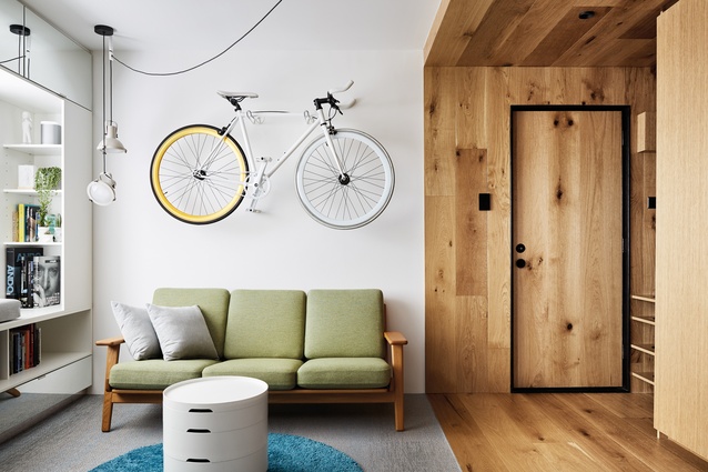 Owned and designed by Jack Chen, this apartment utilises a timber joinery box.
