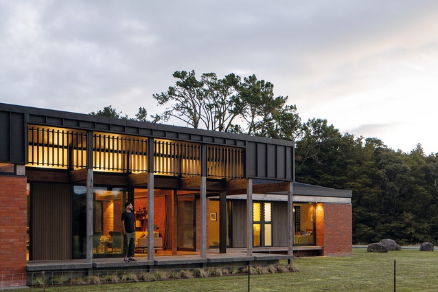 The concrete terrace of the Whareora House provides a platform to view the rural landscape.