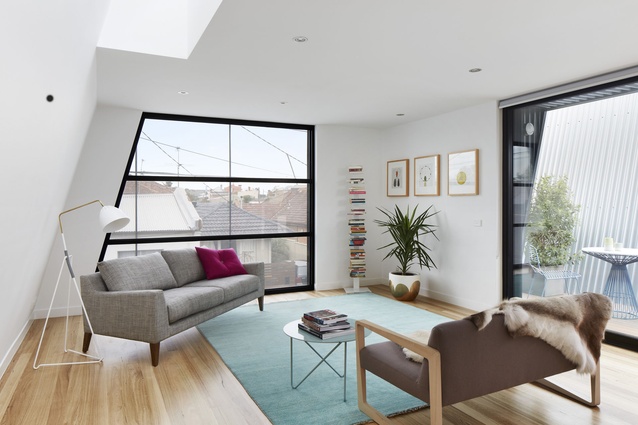 Irregularly shaped windows give the space a contemporary feel and allow plenty of sunlight in.