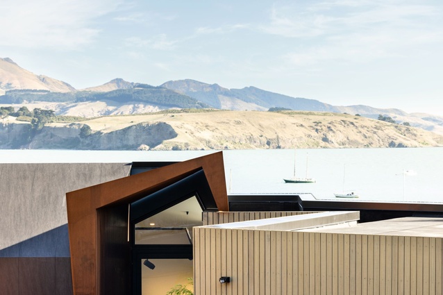 The house overlooks Ōtamahua/Quail Island, with the hills of Banks Peninsula in the distance.